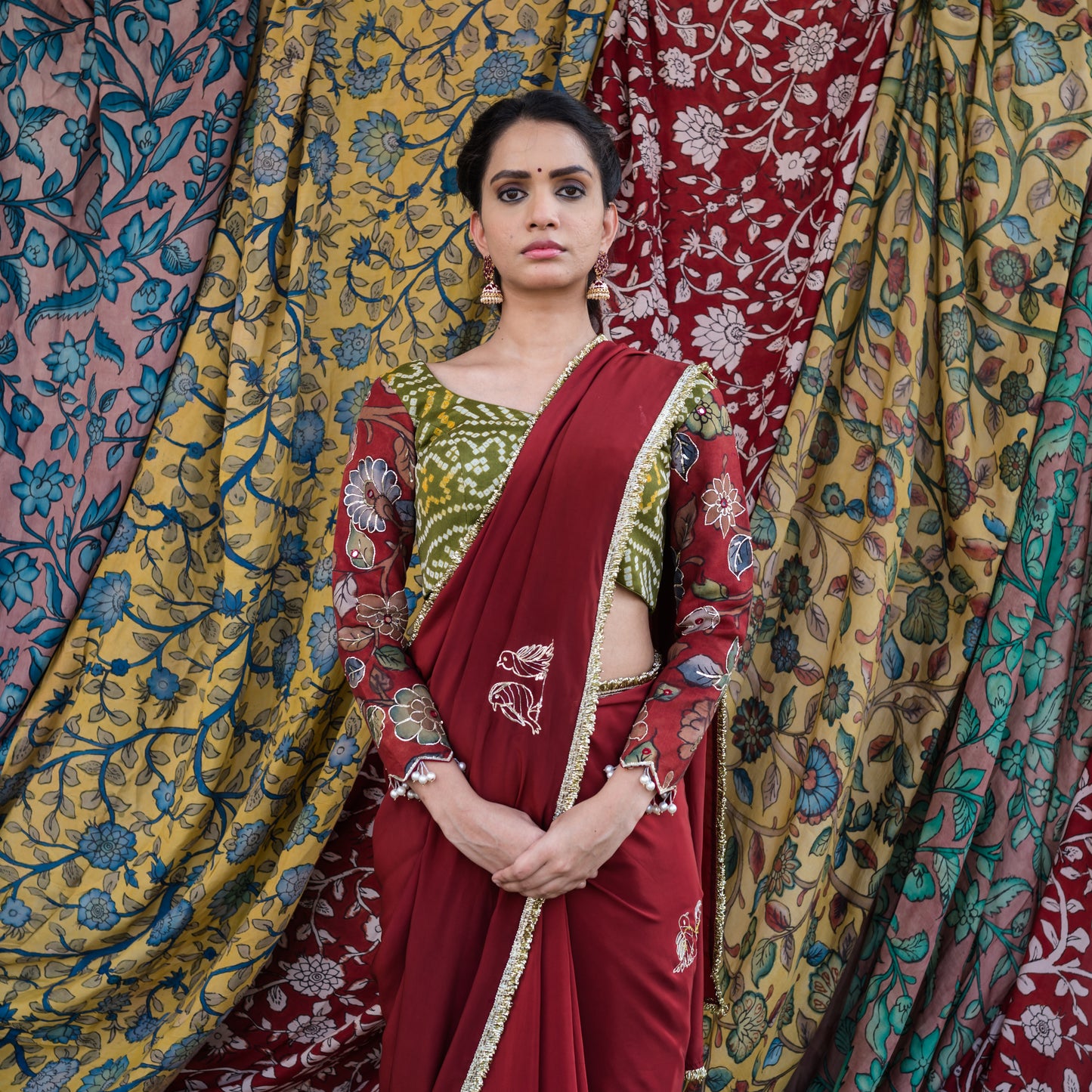 Maroon Crape Saree Set With Embroidered Couple Bird Motifs.