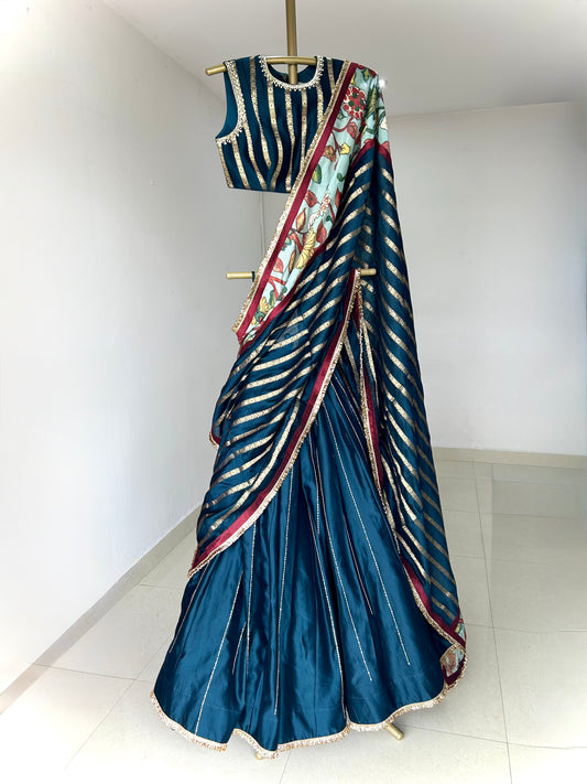 Peacock-Blue Lehenga Set With Kalamkari Detailing.