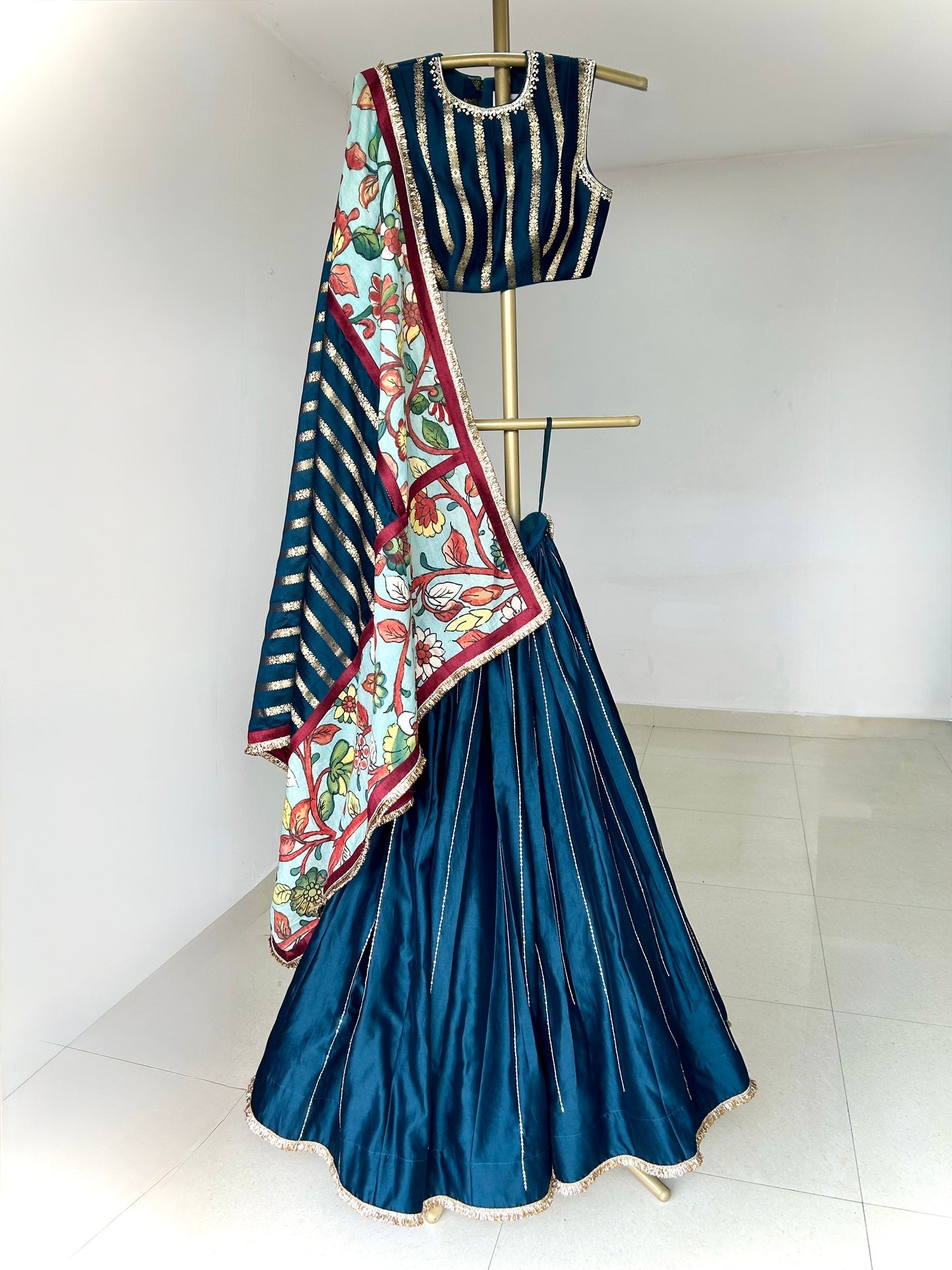Peacock-Blue Lehenga Set With Kalamkari Detailing.